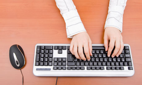 A person typing on a keyboard