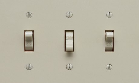 Three light switches, one of which is turned off