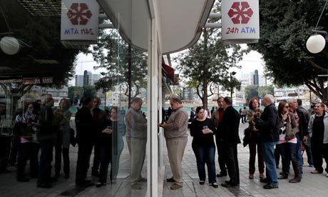 People queue outside Laiki Bank in Nicosia, Cyprus