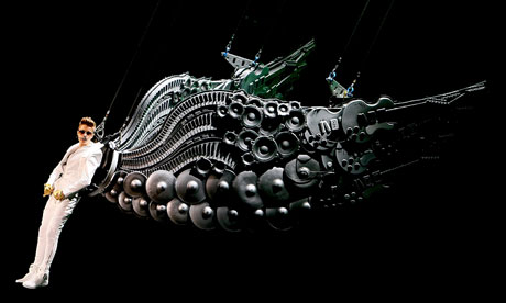 Justin Bieber in concert wearing some metal wings