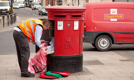 A postman emptying mail from a mailbox