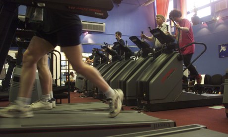 People on running machines in a gym