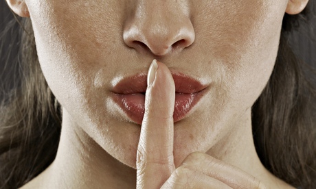 Woman with Finger on Lips