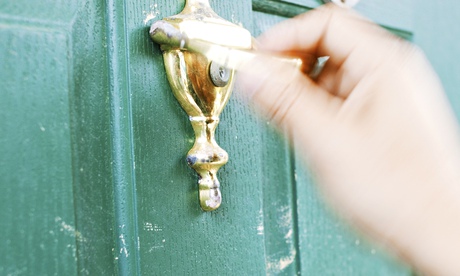 Hand Using Door Knocker