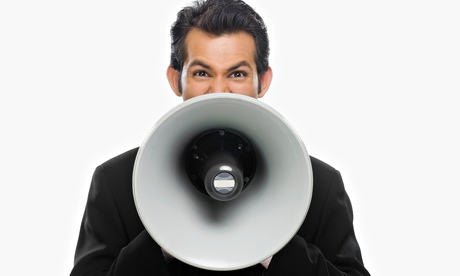 man shouting into a megaphone