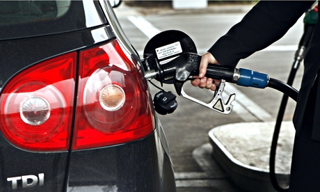 Motorist fills car up with diesel on petrol station forecourt