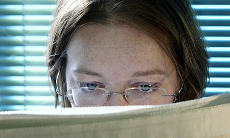 Woman reading the Guardian