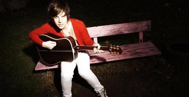 Nick Harrison with a guitar