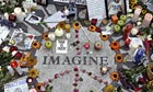 Memorabilia lie on circle with the word Imagine on it to honor deceased John Lennon in Central Park's Strawberry Fields