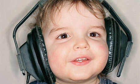 Young child listens to music