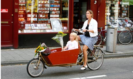 woman riding a bicycle with her daughter Amsterdam Holland. Image shot 08/2007. Exact date unknown.