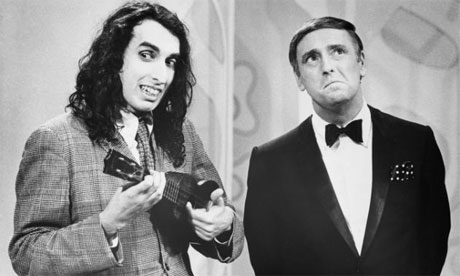 Tiny Tim tries to work his magic on an unconvinced Dick Martin