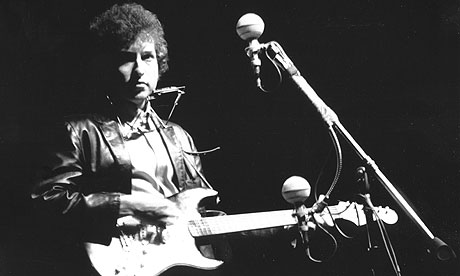 Electric dreams … Bob Dylan plays a Fender Stratocaster for the first time onstage at the Newport folk festival on 25 July 1965. Photograph: Alice Ochs/Getty Images