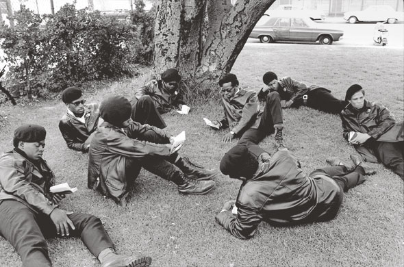Howard Bingham photos: A group of Black Panthers relax in a park in Oakland, California