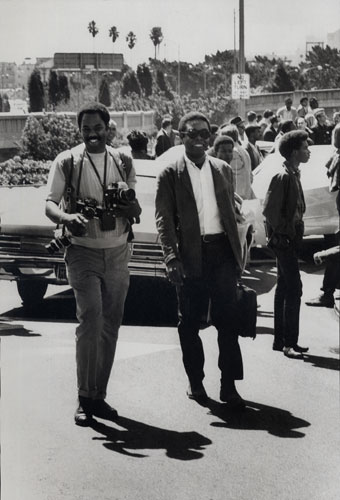 Howard Bingham photos: Photographer Howard L. Bingham and writer Gilbert Moore