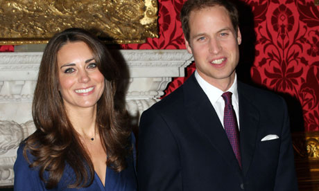 Prince William and Kate Middleton pose for the media the day their 