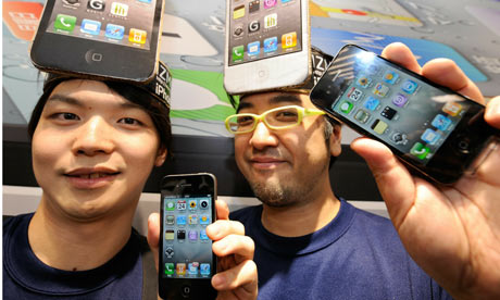 Wearing iPhone placards on their heads,