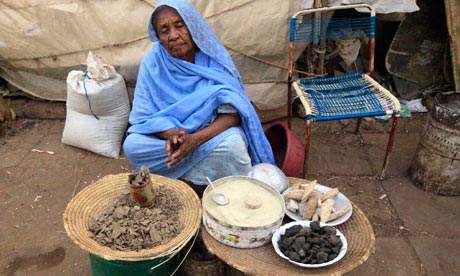 A vendor waits for customers at the market in Khartoum