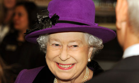 Queen Elizabeth II smiles as she talks t
