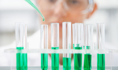 Scientist filling test tubes