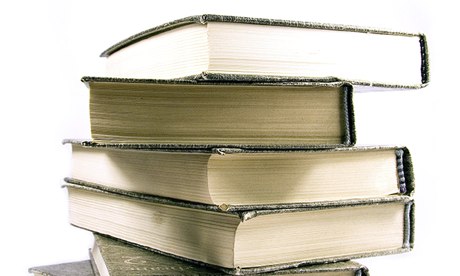 Stack of old books isolated on white