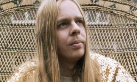 Rick Wakeman at home in a wicker chair, 1970s
