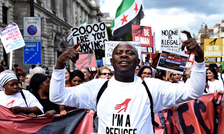 Demonstrators in London make their way down Whitehall.