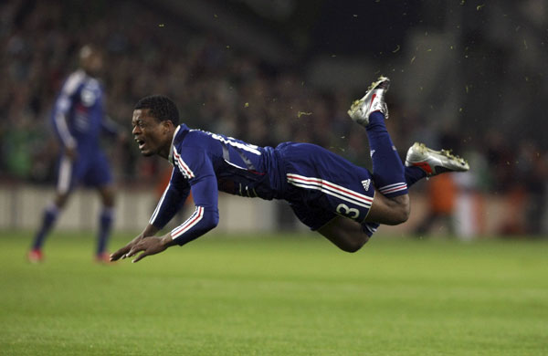 Ireland v France: France's Evra reacts after tackle in World Cup match against Ireland