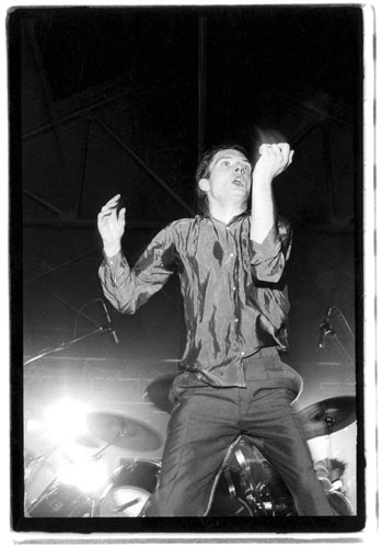 Kevin Cummins' Manchester: Ian Curtis dancing on stage with Joy Division in 1979, by Kevin Cummins