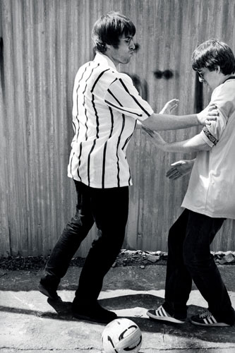Kevin Cummins' Manchester: Liam and Noel Gallagher playing football in 1994, by Kevin Cummins