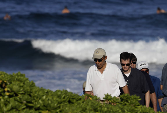 Obs Obamas on holiday: Barack Obama walks on the beach on Marine Corps Base Hawaii in Kaneohe Bay