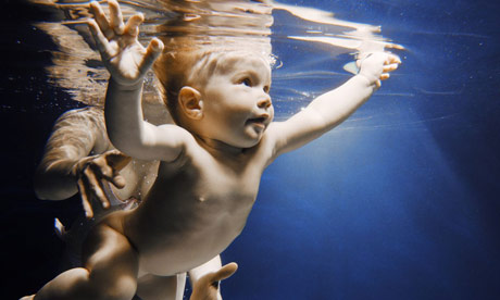 Swimming with Baby Babies reflexes mean that they instantly hold their