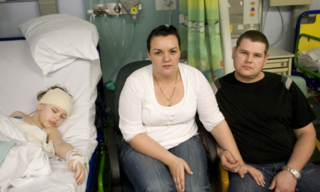 Kian Hendrich with his parents Anri and Karl Kian had brain surgery 