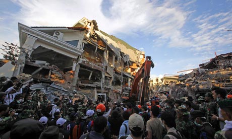 Rescue workers look for survivors inside the Ambacan Hotel