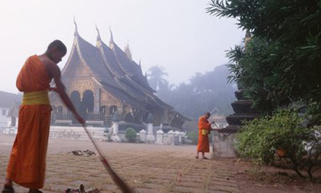 Monks perform daily chores in Luang Prabang. 