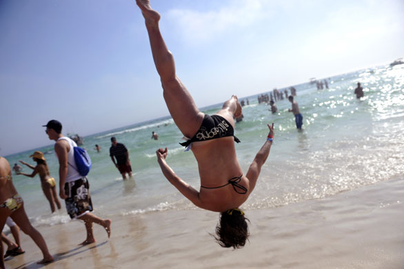 Spring break: Students doing backflips on the beach