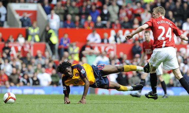 Man Utd. league champions: Alexandre Song is fouled by Darren Fletcher