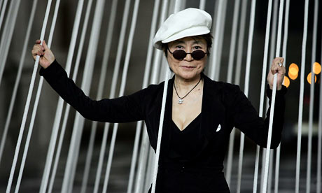 Yoko Ono posing with installati...