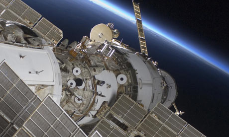 The International Space Station flanked by the Earth's horizon.