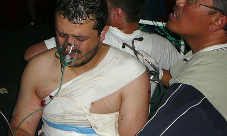 A wounded activist is treated on the Mavi Marmara
