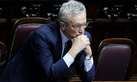 Glum-looking Italian finance minister Giulio Tremonti rests head on elbows