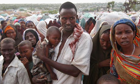 A male binds his three-year-old daughter during a stay for replaced persons in Mogadishu. Getty photo