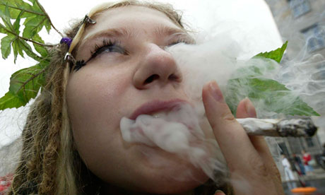 WOMAN SMOKES DURING A DEMONSTRATION IN BERLIN