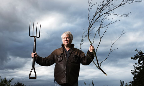Richard Mabey waving fork, branch