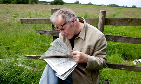 Nick Papadimitriou reads a map on the Scarp
