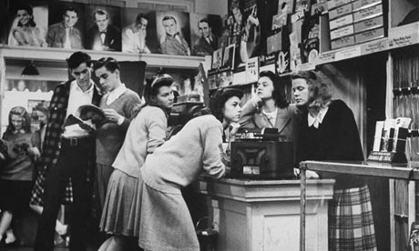 Group of teenagers listening to 45 rpm.