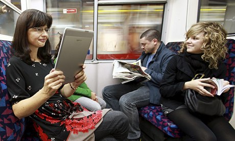 Readers on an underground train