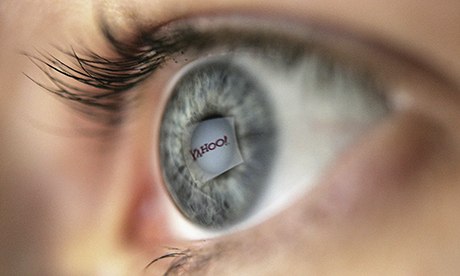 Yahoo logo reflected in the pupil of an eye framed by eyelashes