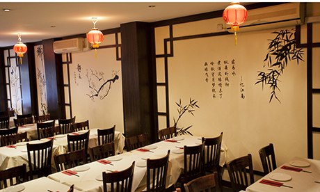 Tables and paper lanterns at Sichuan Folk in Shoreditch