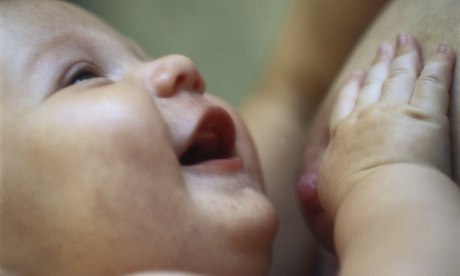 smiling baby at breast